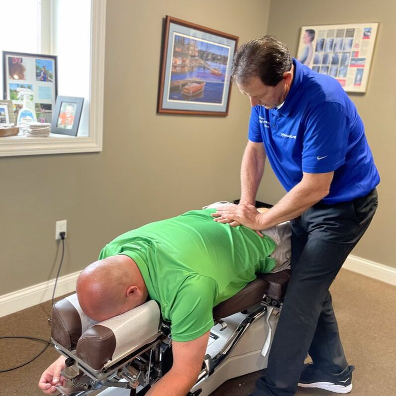 Chiropractor improving spinal health